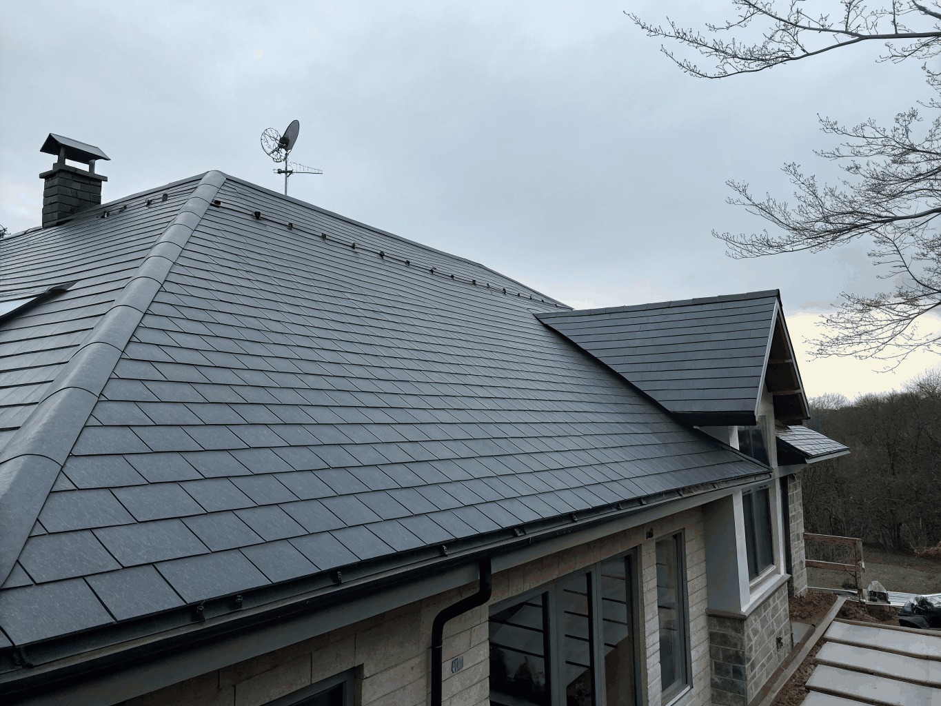 Modern solar attic fan installed on a roof