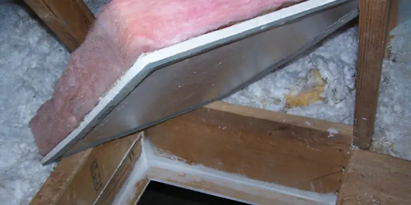 Basic unsealed plywood attic hatch cover with gaps